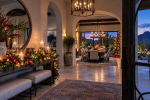 Warm foyer lighting and a holiday tablescape set for a dinner party in a Scottsdale, AZ home